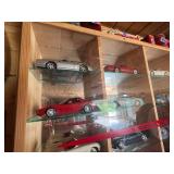 Display Cabinet Full of Various Year Corvettes