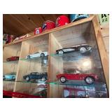 Display Cabinet Full of Various Year Corvettes