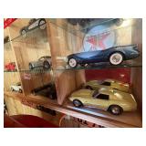 Display Cabinet Full of Various Year Corvettes