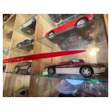 Display Cabinet Full of Various Year Corvettes