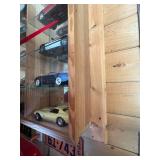 Display Cabinet Full of Various Year Corvettes