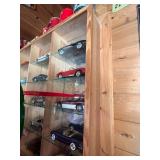 Display Cabinet Full of Various Year Corvettes