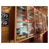 Display Cabinet Full of Various Year Corvettes