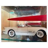 Display Cabinet Full of Various Year Corvettes