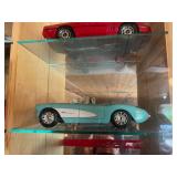 Display Cabinet Full of Various Year Corvettes