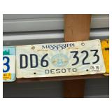 Row of Assorted Vintage License Plates