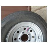 New ST145r12 trailer on 5 hole rim. As shown.