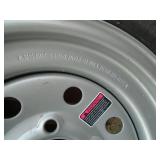 New ST145r12 trailer on 5 hole rim. As shown.