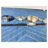 4 Bracelet style watches and 1 buckle band watch