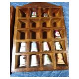 2 small shadow boxes with ceramic and wood Thimbles