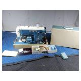 Vintage Signature sewing machine with attatchments and extra belts in case