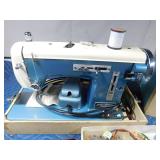 Vintage Signature sewing machine with attatchments and extra belts in case