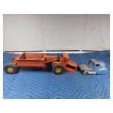 vintage metal tractor with grain hauler and old metal semi