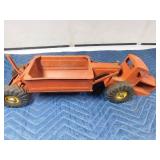 vintage metal tractor with grain hauler and old metal semi