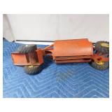 vintage metal tractor with grain hauler and old metal semi