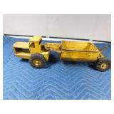 Metal tractor with grain trailer