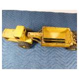 Metal tractor with grain trailer