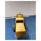 Metal tractor with grain trailer