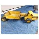 Metal tractor with grain trailer