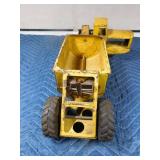 Metal tractor with grain trailer