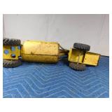 Metal tractor with grain trailer