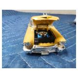 2 die cast cars and 1 tin car