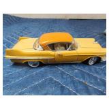 2 die cast cars and 1 tin car