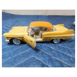 2 die cast cars and 1 tin car