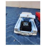 2 die cast cars and 1 tin car