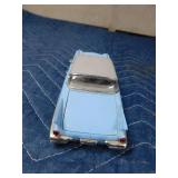 2 die cast cars and 1 tin car