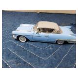 2 die cast cars and 1 tin car