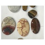 Lot of polished rocks with agates and a rock made into jewelry