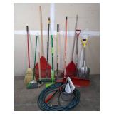 A Variety of Cleaning Tools Including Rakes, Garden Hose, Snow Shovel and More