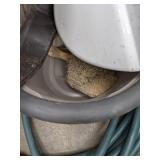 A Variety of Cleaning Tools Including Rakes, Garden Hose, Snow Shovel and More