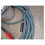 A Variety of Cleaning Tools Including Rakes, Garden Hose, Snow Shovel and More