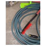 A Variety of Cleaning Tools Including Rakes, Garden Hose, Snow Shovel and More