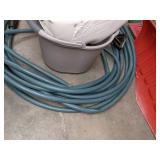 A Variety of Cleaning Tools Including Rakes, Garden Hose, Snow Shovel and More