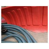 A Variety of Cleaning Tools Including Rakes, Garden Hose, Snow Shovel and More