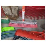 A Variety of Cleaning Tools Including Rakes, Garden Hose, Snow Shovel and More