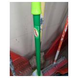 A Variety of Cleaning Tools Including Rakes, Garden Hose, Snow Shovel and More