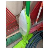 A Variety of Cleaning Tools Including Rakes, Garden Hose, Snow Shovel and More