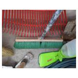 A Variety of Cleaning Tools Including Rakes, Garden Hose, Snow Shovel and More