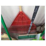 A Variety of Cleaning Tools Including Rakes, Garden Hose, Snow Shovel and More
