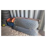 Rolls of wire mesh and seeders OS