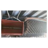 Rolls of wire mesh and seeders OS