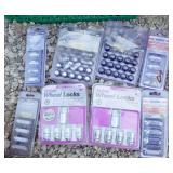 Multiple Packages of wheel lock nuts and battery cables