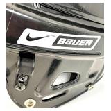 2 Hockey Sticks / 3 Packs of Hockey Tape and 2 BAUER Helmets