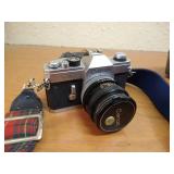 Vintage Canon SLR With Strap, Case, 50mm Lens, And Lens Filter