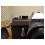 Vintage Canon SLR With Strap, Case, 50mm Lens, And Lens Filter