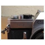 Vintage Canon SLR With Strap, Case, 50mm Lens, And Lens Filter